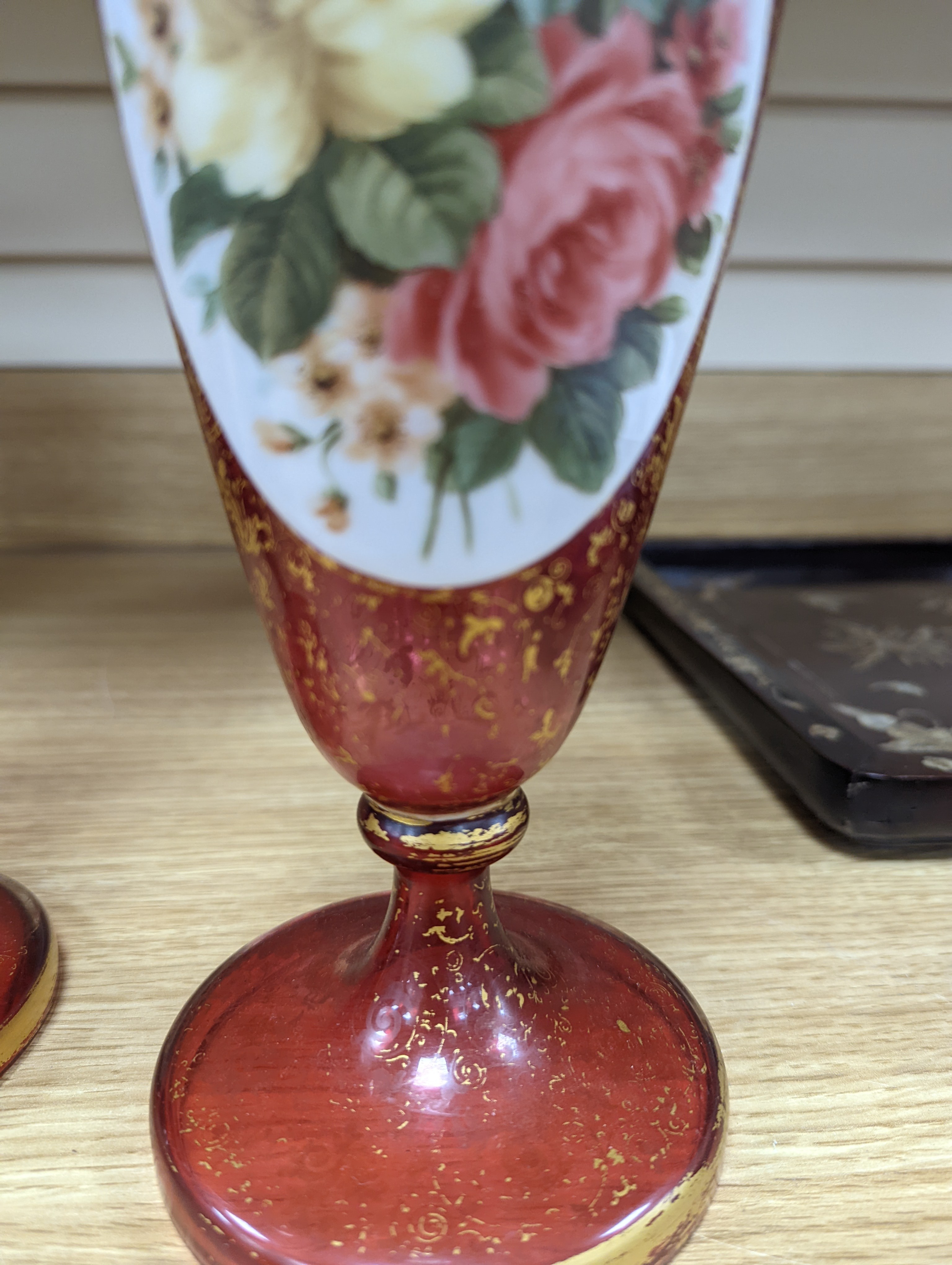 A pair of 19th century Bohemian enamelled and overlaid ruby glass vases 36cm